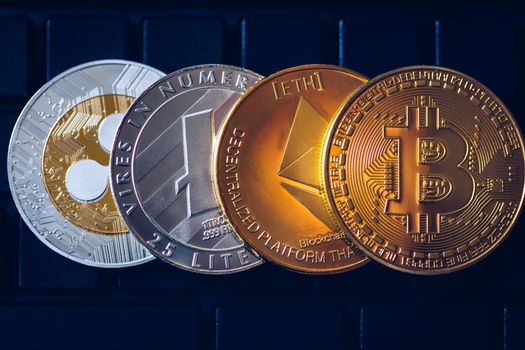Set of cryptocurrencies with Bitcoin, Etherium, Ripple, Litecoin. Cryptocurrencys new digital money. Bitcoin on the front as the leader. Bitcoin as most important cryptocurrency.