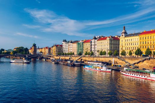 Scenic embankment in Prague city; Historical center of Prague, buildings and landmarks of old town, Prague, Czech Republic. Embankment of the Vltava river in Prague, the capital of Czechia.