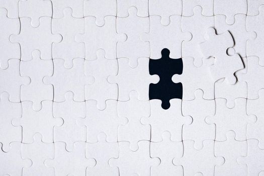 Jigsaw puzzle with missing piece. Missing puzzle pieces. Concept image of unfinished task. Completing final task, missing jigsaw puzzle pieces and business concept with a puzzle piece missing.