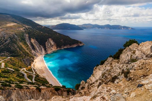 Famous Myrtos beach from overlook, Kefalonia (Cephalonia), Greece. Myrtos beach, Kefalonia island, Greece. Beautiful view of Myrtos beach, Ionian Island, Kefalonia (Cephalonia), Greece.