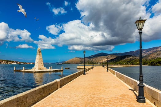 View of the De Bosset Bridge in Argostoli city on Kefalonia island. De Bosset Bridge on lakeside In Argostoli, Kefalonia. Obelisk and the de Bosset bridge in Argostoli, Kefalonia, Greece