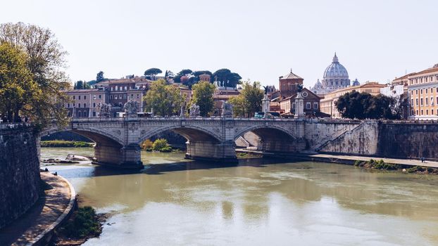 Skyline with bridge Ponte Vittorio Emanuele II and classic architecture in Rome, Vatican City scenery over Tiber river.