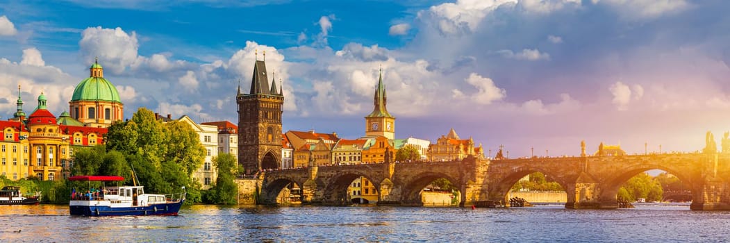 Prague in a sunny day, view of the old town, Prague, Czech Republic. Scenic summer view of the Old Town pier architecture and Charles Bridge over Vltava river in Prague, Czech Republic