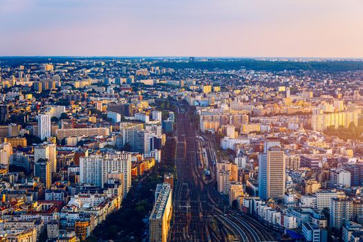 Top view of Paris skyline from above. Main landmarks of european megapolis with train station of Vaugirard-Belt. Bird-eye view from observation deck of Montparnasse tower. Paris, France