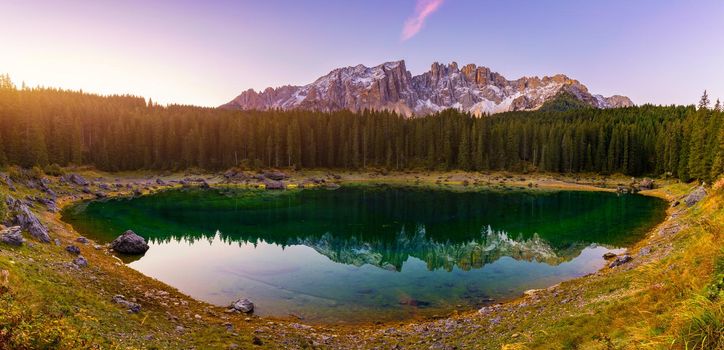 Carezza lake (Lago di Carezza, Karersee) with Mount Latemar, Bolzano province, South tyrol, Italy. Landscape of Lake Carezza or Karersee and Dolomites in background, Nova Levante, Bolzano, Italy.