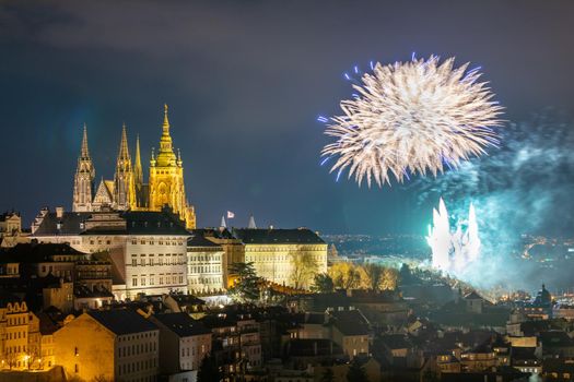 Fireworks over the Old Town of Prague, Czech Republic. New Year fireworks in Prague, Czechia. Prague fireworks during New Year Celebration near St. Vitus Cathedral, Prague, Czech republic.