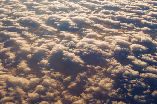 Blanket of clouds. Sun going below a blanket of clouds. On top of a blanket of clouds. Sun going below a blanket of clouds. Smooth view from above with a blanket of clouds.