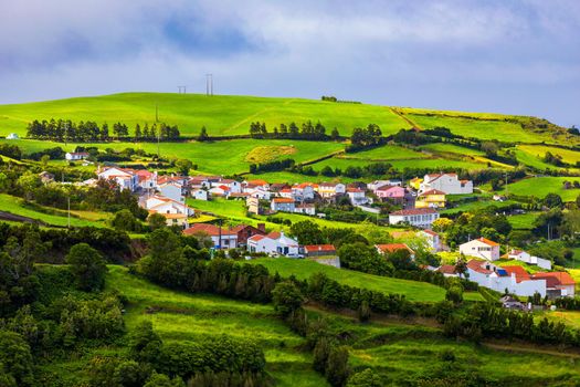 Beautiful nature view on Azores with small villages, tows, green nature fields. Amazing Azores. View of typical Azores village in Sao Miguel island, Azores, Portugal.