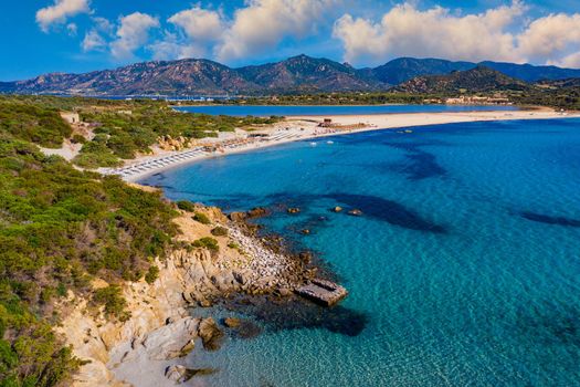 Panoramic view of sandy beach, yachts and sea with azure water, in Villasimius, Sardinia (Sardegna) island, Italy. Holidays, the best beaches in Sardinia. Porto Giunco beach, Villasimius, Sardinia.