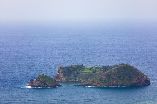 Island of Vila Franca do Campo from the chapel of Nossa Senhora da Page. San Miguel Island, Portugal. Travel to the Azores. Island of Vila Franca do Campo near San Miguel island, Azores, Portugal.