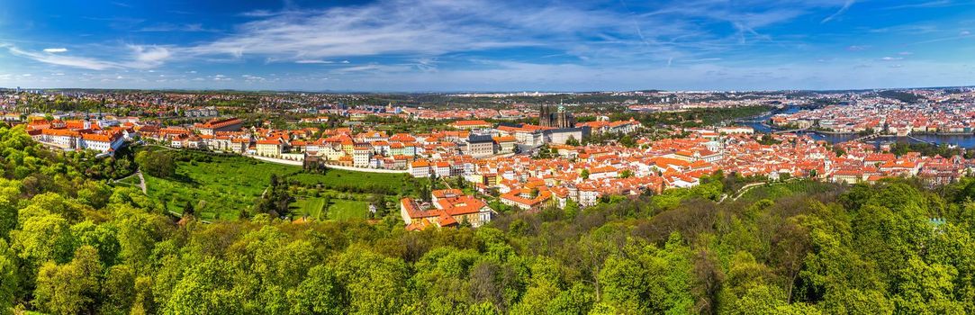 Skyline aerial view of Prague old town, Charles bridge, Prague Castle and St Vitus Cathedral and red roofs. Prague, Czech republic.