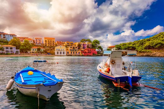 Assos village in Kefalonia, Greece. Turquoise colored bay in Mediterranean sea with beautiful colorful houses in Assos village in Kefalonia, Greece, Ionian island, Cephalonia, Assos village.
