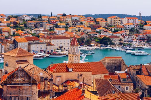 Trogir in Croatia, town panoramic view with red roof tiles, Croatian tourist destination. Trogir town sea front view, Croatia. Roofs of Trogir in Croatia.
