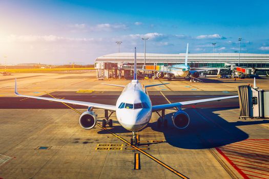 Passenger airplane getting ready for flight. Front view of landed airplane in  International Airport. Airplane being preparing ready for takeoff in international airpor. Travel around the world.