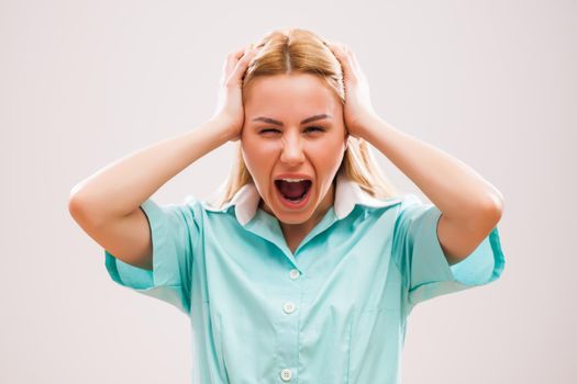 Portrait of young nurse who is in panic.