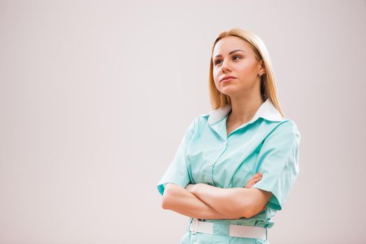 Portrait of young nurse who is worried and pensive.