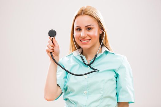 Portrait of young nurse who is holding stethoscope.