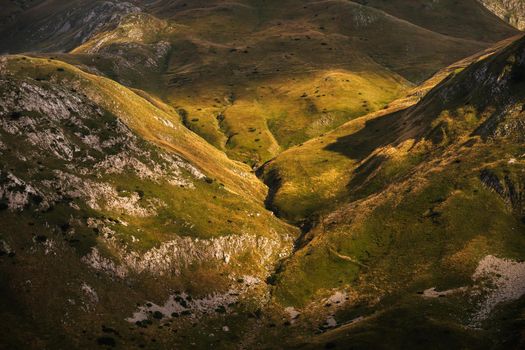 Sunbeam on hillside in mountain.