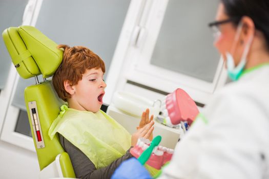 Little boy doesn't want to clean his teeth.