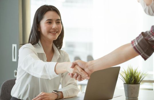 Asian Business people shaking hand, finishing up meeting, business etiquette, congratulation, merger and acquisition concept.