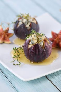 Figs stuffed with blue cheese and thyme, seasoned with honey
