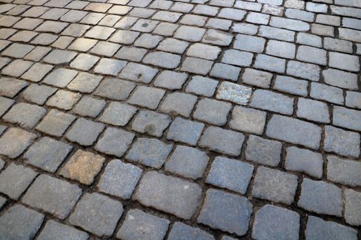 Blurred background, out of focus. Paving stones background in the old part of the city