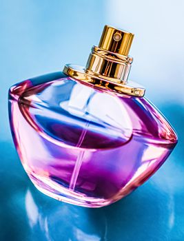 Perfume bottle on glossy background, sweet floral scent, glamour fragrance and eau de parfum as holiday gift and luxury beauty cosmetics brand design.