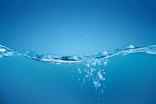 Water waves ,Splashed water wave in clean blue water.