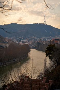 The Kura River flows through the city of Tbilisi. City landscape.