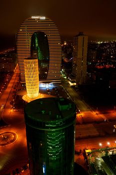 Night cityscape of Batumi. Modern architecture in the city lights.