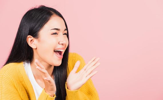 Happy Asian portrait beautiful cute young woman standing surprised excited screaming open mouth show hand studio shot isolated on pink background, Thai female smile winner successful with copy space