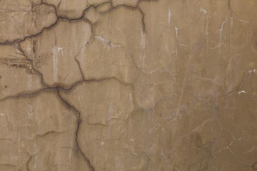 gray dirty cracked plaster wall - flat texture and full frame background.