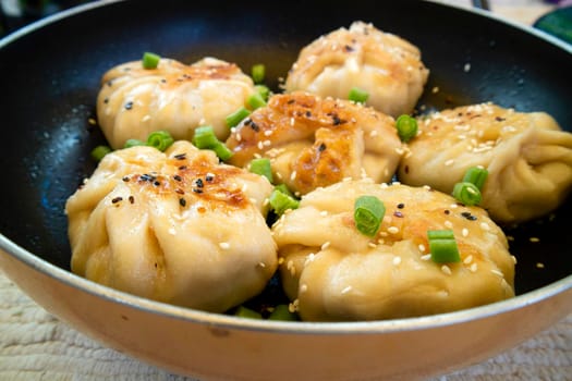 Vegan cuisine. spelled flour ravioli stuffed with vegetables and tofu cooked in a pan. 