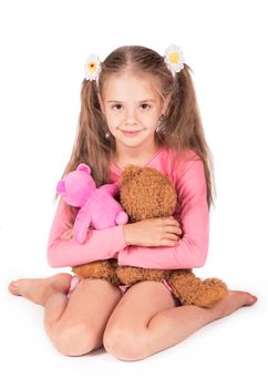 Happy girl with two teddy bears isolated on white