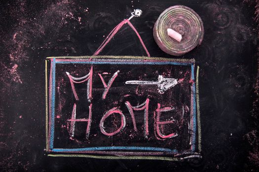 Submission of written home, with chalk on blackboard