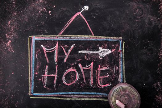 Submission of written home, with chalk on blackboard