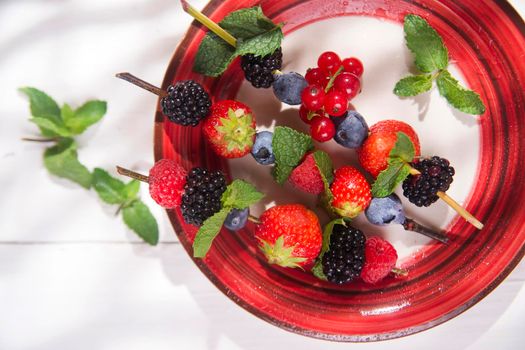 Presentation set of skewers of berries, summer dish