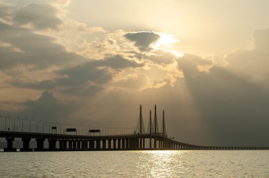 Penang bridge in morning with sun ray.