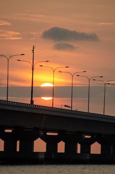 Half of sun disappear in cloud at Penang second bridge.