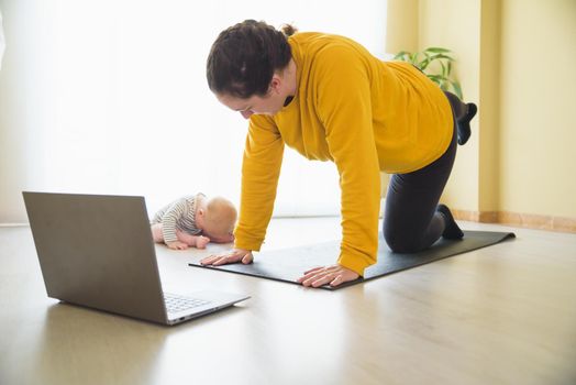 Mother and daughter doing exercise home.