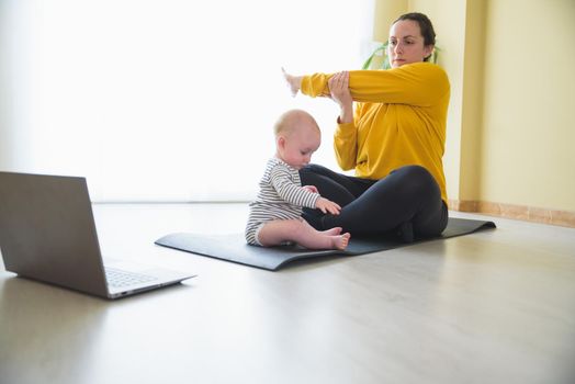 Mother and daughter doing exercise home.