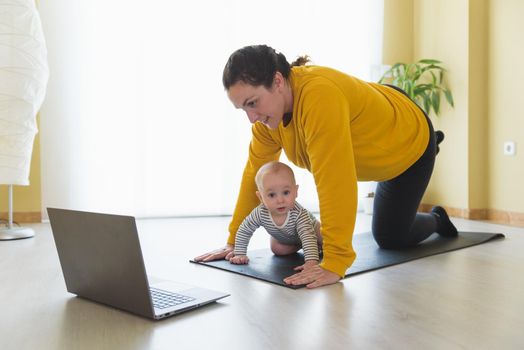 Mother and daughter doing exercise home.