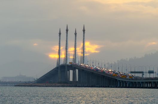 Orange cloud near Penang Bridge in sunrise morning