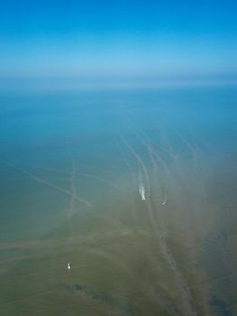 Aerial view fishing boat moving trace at Kuala Muda.