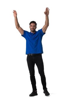 Full length casual portrait of handsome tall young man standing with arms raised isolated on white background