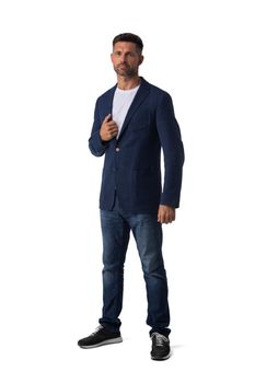 Full length portrait of mid adult serious business man in jeans and blue blazer isolated on white background, casual people