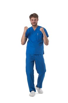 Young male medical nurse healthcare worker holding fists isolated on white background full length studio portrait