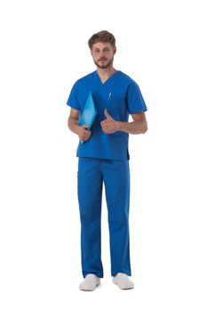 Male nurse in blue uniform with stethoscope and document folder show thumb up isolated on white background, full length portrait