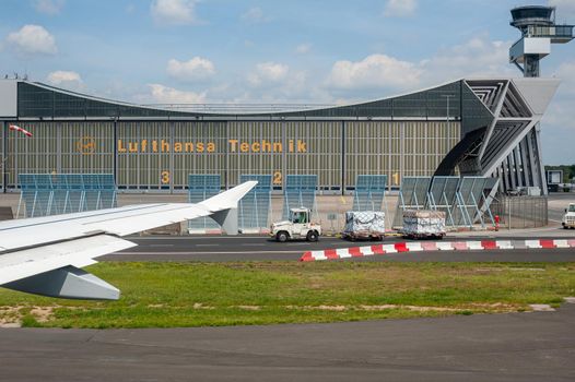 05/26/2019. Frankfurt Airport, Germany. Lufthansa Technik maintenance hangar with control tower. Airport operated by Fraport and serves as the main hub for Lufthansa including Lufthansa City Line and Lufthansa Cargo.