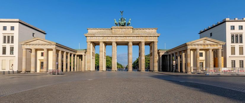 Panorama of the famous Brandenburg Gate in Berlin early in the morning with no people